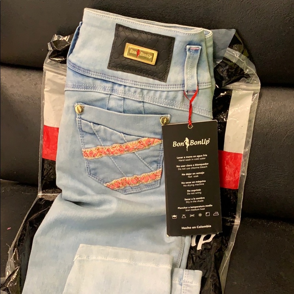 Jeans light blue with peach-gold accents